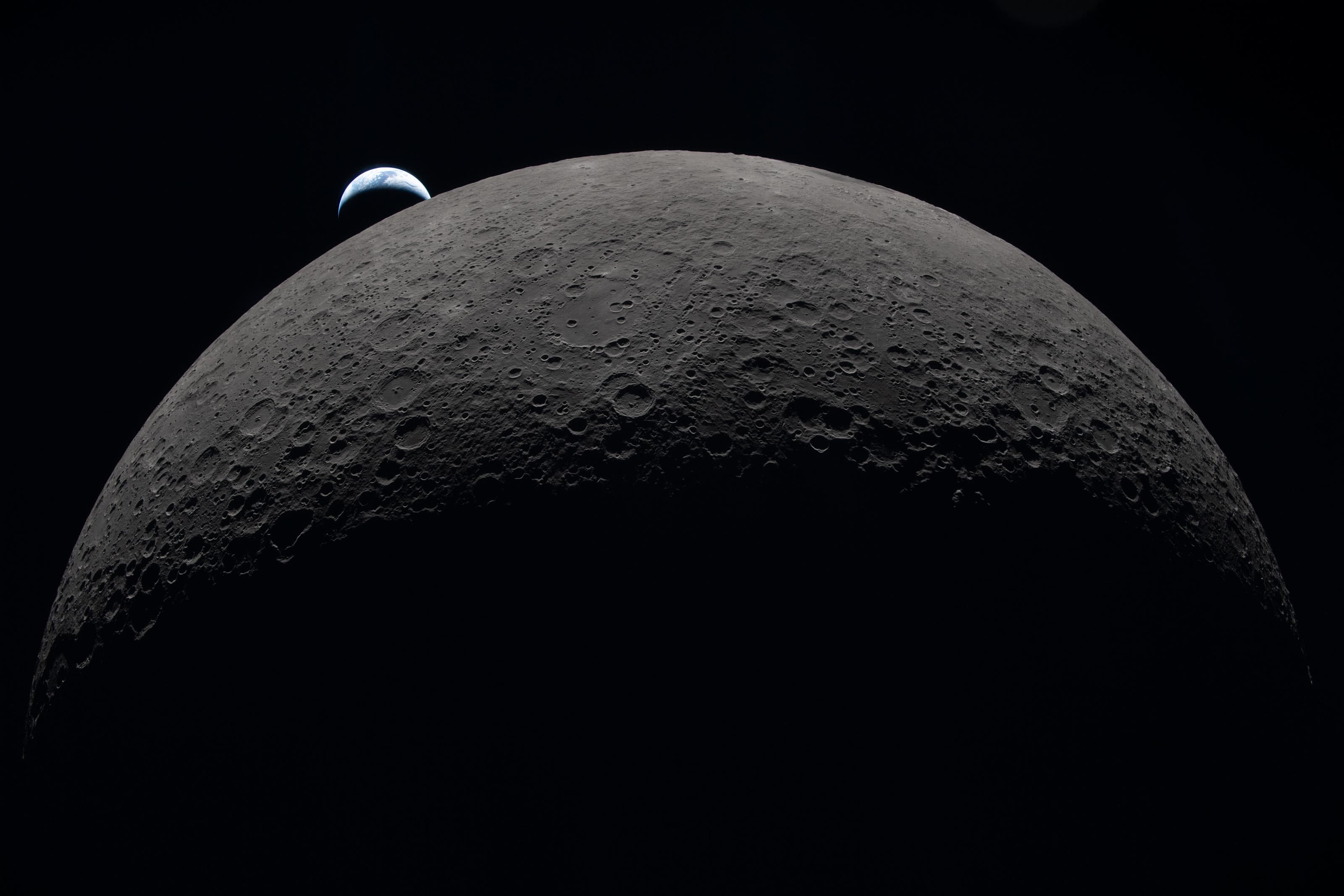 Earth setting behind the edge of the Moon, photographed on Artemis II